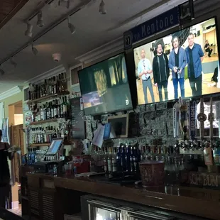 people watching tvs in the bar