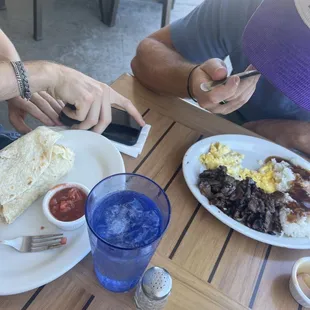 Breakfast burrito and steak meal