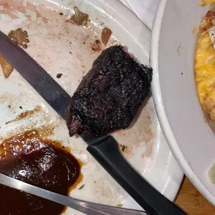 a plate of food and a knife