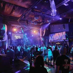 a crowd of people dancing at a party