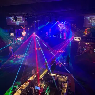 a bar with laser lights