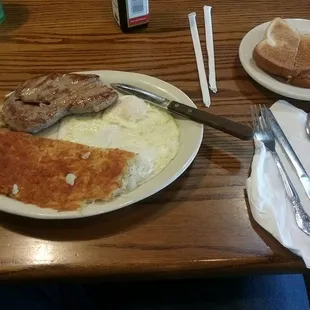 a breakfast of eggs, sausage and toast