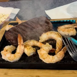 3 Choices of 30+ days Aged Steak!  Seasoned, Seared &amp; Sent to your table on a hot stone! 
Local-made Dinner Roll Buttered &amp; heated on stone