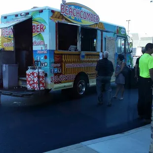 people getting food from the truck