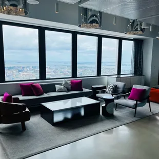 a living room with a view of the city