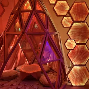 a room with a tent and a table