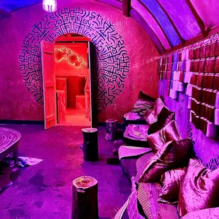 the interior of a room with purple lighting