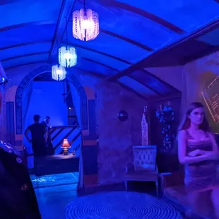 a man and a woman in a dimly lit room