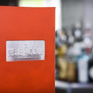 a close up of a bar with bottles in the background