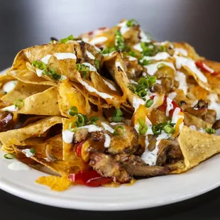 a plate of nachos on a table