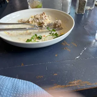 The remnants of biscuits and gravy.