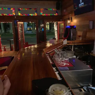 a bar with a wooden bar top