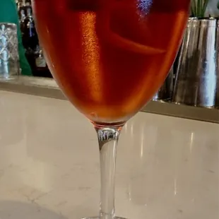 a glass of wine on a counter