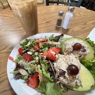 Stuffed avocado with a strawberry vinaigrette salad