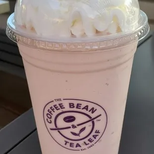 a cup of coffee with whipped cream