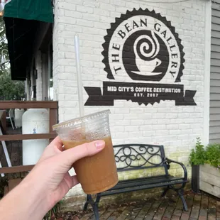 Cold brew w/oat milk outside of the shop
