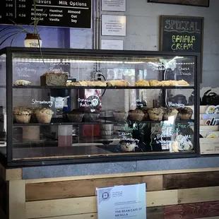 a display case filled with baked goods
