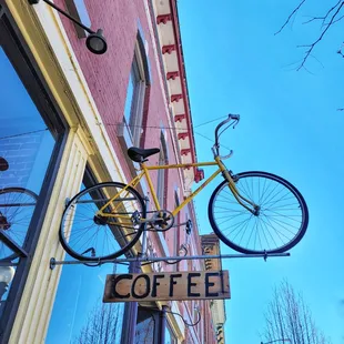 a coffee shop sign and a bicycle