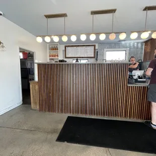 a woman standing at a counter