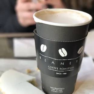 Soy chai latte and half eaten lemon poppyseed cookie