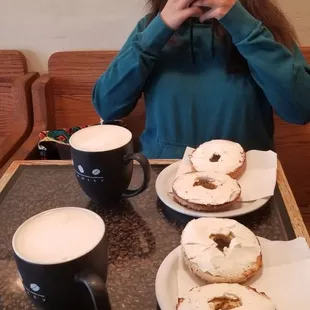 a woman taking a picture of her breakfast