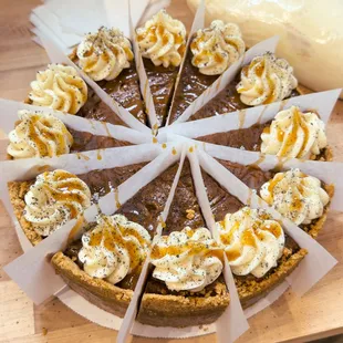 a chocolate pie topped with whipped cream and caramels