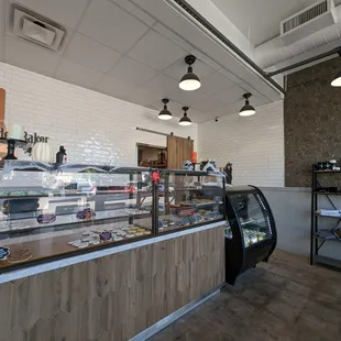 a bakery counter with a display of baked goods