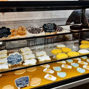 Assorted sugar cookies, macaron, and brownie