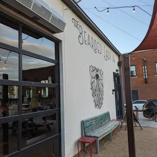 a bench outside of a restaurant