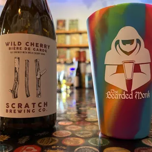 two bottles of beer on a bar