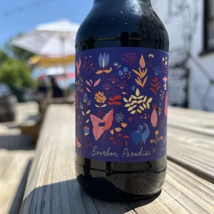 a bottle of beer on a wooden table