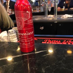 a bottle of beer on a bar