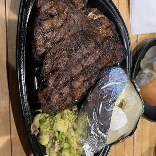 Porterhouse steak bristle sprouts and bakes potato