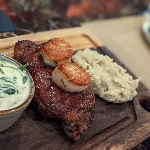 Steak, scallops, spinach and masked potatoes