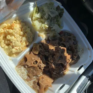 Oxtails over rice, Mac and cheese and cabbage