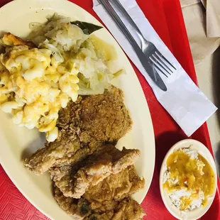 Fried pork chops, Mac n cheese, cabbage. Side of rice and gravy. So delicious!