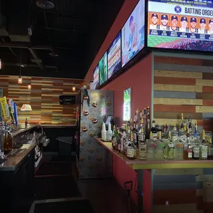 a bar with a large television screen