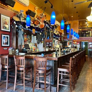 a bar with wooden chairs