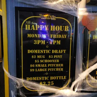 a sign for a happy hour