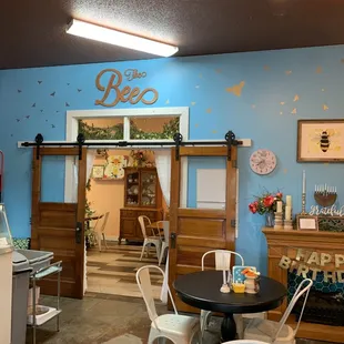 the inside of a restaurant with tables and chairs