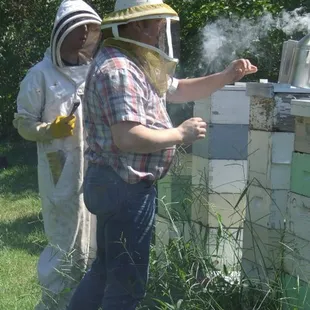 a man and a woman in bee suits