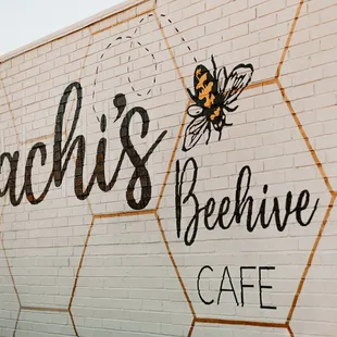 a bee on the side of the building