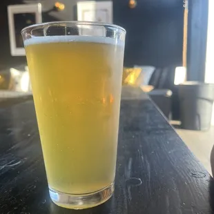 a glass of beer on a table