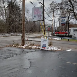 a sign in the middle of the street