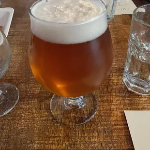 a glass of beer on a table