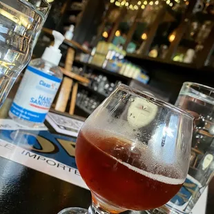 a glass of beer on a table