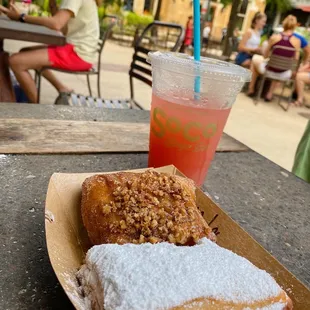 a plate of donuts and a drink
