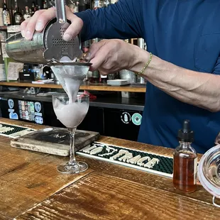 a bartender making a drink