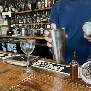 a bartender mixing a drink
