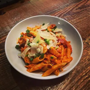 Garganelli pasta with speck, smoked prosciutto, garlic, tomato, touch of cream